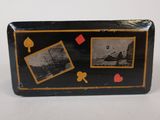 a black suitcase with pictures on it sitting on a table