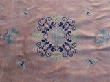 a very old rug with a fancy design on it