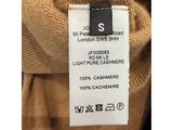 a close up of a label on a brown sweater