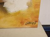 a painting of a sheep that is sitting on a table