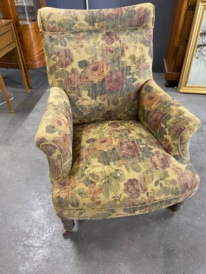 an old chair with floral upholstered upholstered upholstered upholstered upholstered up