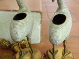 two vases that are sitting on top of a table