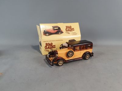 a small toy car with a box on the back of it