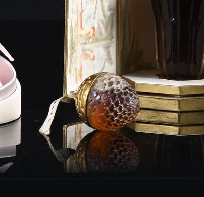 a cup of coffee and a pair of shoes on a table