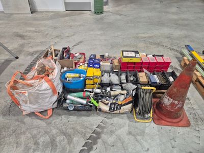 a lot of tools on the floor in the garage