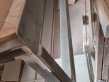 several pieces of wood are stacked on top of each other in a room