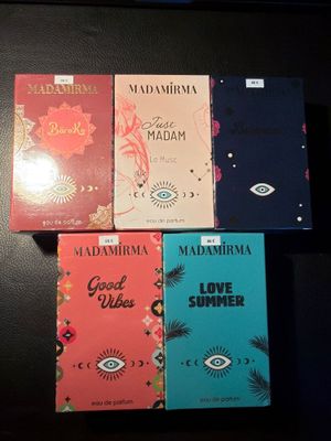 four books on a table with a black background