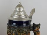 an image of a beer mug with a cat on it