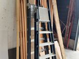 a ladder that is leaning against a wall in a garage