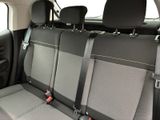 four seats in the back of a car that are empty