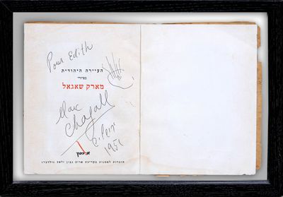 a book with some writing on it in a black frame