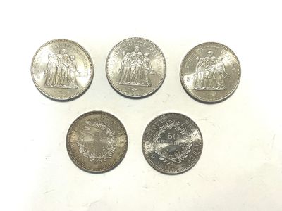 four different types of coins are shown on a white surface