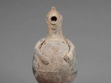 an image of a vase with a bird on it