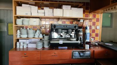 a coffee machine sitting on a counter in a kitchen