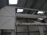 a picture of a large building with a ladder in it