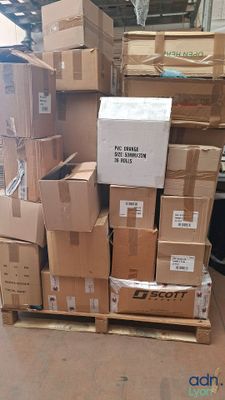 many boxes stacked on a pallet in a warehouse