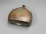 an old metal purse sitting on top of a table