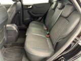the back seats of a car are black with red stitching