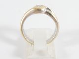 a close up of a silver ring on a white surface