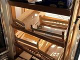 many boxes of wine sitting on the shelves in the room