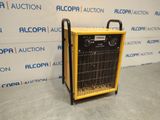 un radiateur jaune et noir posé sur un sol gris