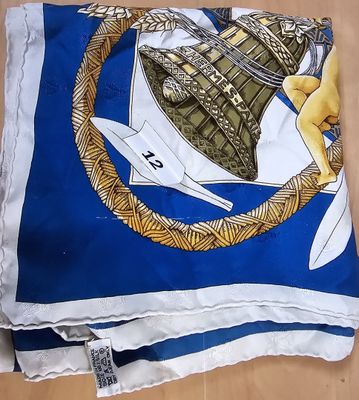 a blue and white scarf with a picture of a boat on it