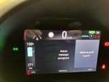 a picture of a car dashboard with a digital display