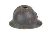 a helmet that has rusted paint on it