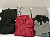 several men ' s shirts and pants laid out on a white surface