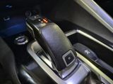 a close up view of a car ' s gear lever