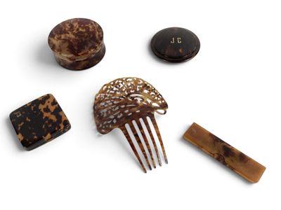 several pieces of hair accessories are arranged on a white surface