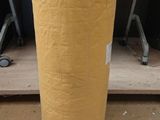a large roll of yellow paper sitting on a table