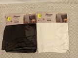 two pairs of black and white pants sitting on top of a table