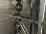 two fans that are attached to the side of a metal wall
