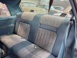 an image of a car seat with a dog in the back seat