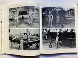a book with pictures of people standing in front of an airplane