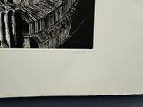 a black and white picture of a clock on a wall
