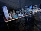 a table with a lot of glasses and cups on it