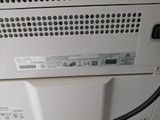a white machine with a black cord attached to it