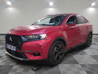 a red dsx suv parked in a showroom