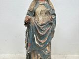 statue of a woman holding a baby in her arms