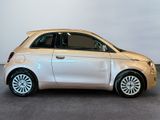 a picture of a small white car parked in a showroom