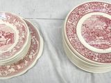 two red and white plates sitting on top of each other on a table