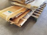 a pile of cardboard sitting on a pallet in a room