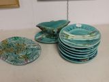 a lot of plates that are sitting on a table