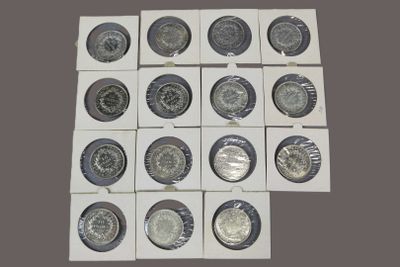 a lot of different types of coins in a box