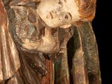 a statue of a man holding a child in his arms