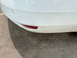 a white car that is parked in a parking lot