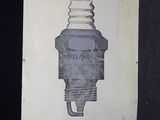 un panneau sur lequel figure l'image d'une bougie d'allumage