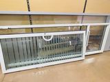 a window that has been opened and is sitting on the floor